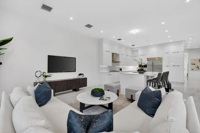 a bedroom with a bed and a potted plant