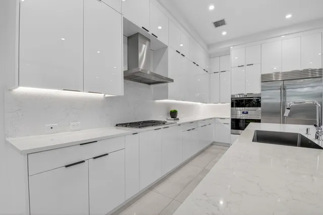 a view of a hallway with wooden floor and windows