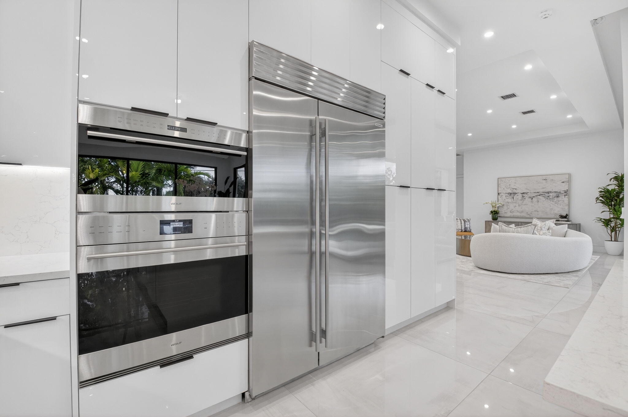 2232 Delray Ridge Lane Delray Beach, FL 33444 - Photo 30 of 68 a kitchen with kitchen island a stove and a refrigerator