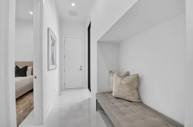 a bathroom with a granite countertop sink a toilet and shower
