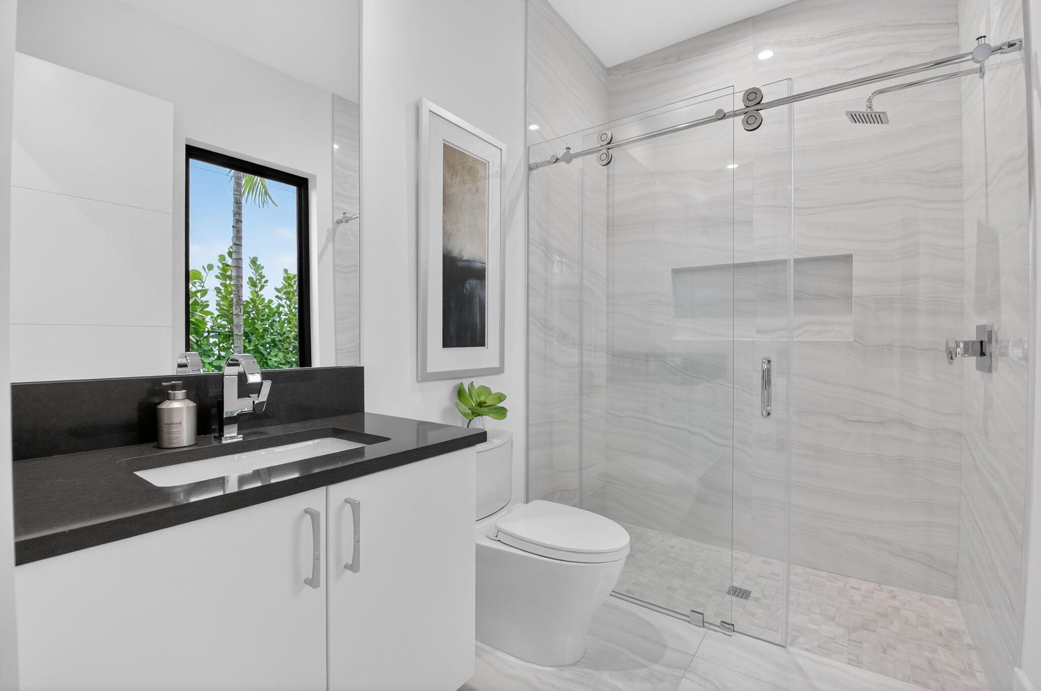 2232 Delray Ridge Lane Delray Beach, FL 33444 - Photo 35 of 68 a bathroom with a granite countertop sink a toilet and shower