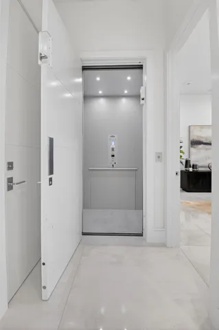 a view of a chairs and table in the balcony