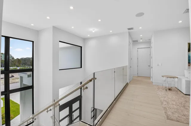 a bathroom with a double vanity sink a mirror and a bathtub