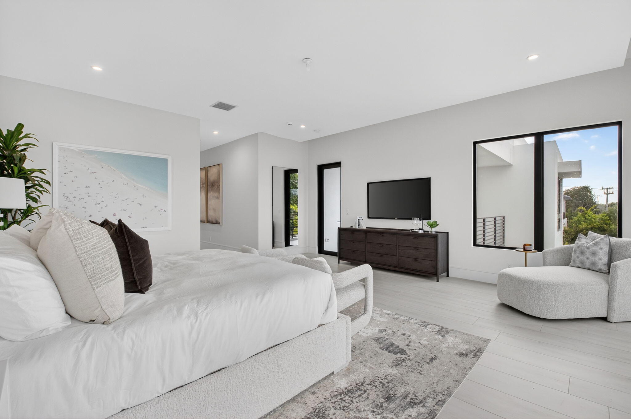 2232 Delray Ridge Lane Delray Beach, FL 33444 - Photo 47 of 68 a bedroom with a bed and a flat screen television