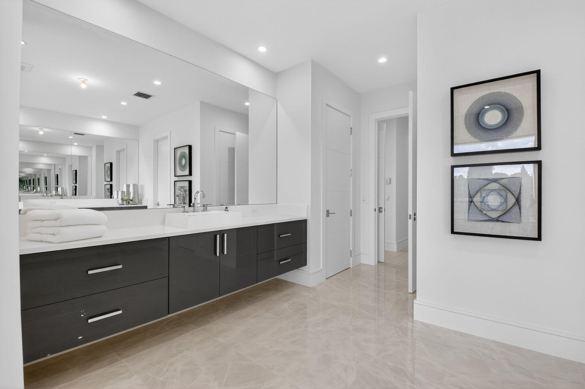 2232 Delray Ridge Lane Delray Beach, FL 33444 - Photo 53 of 68 a spacious bathroom with a double vanity sink and a mirror