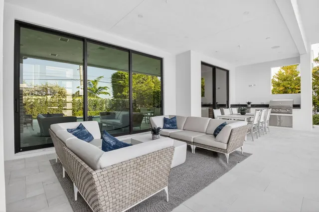 a view of swimming pool with outdoor seating