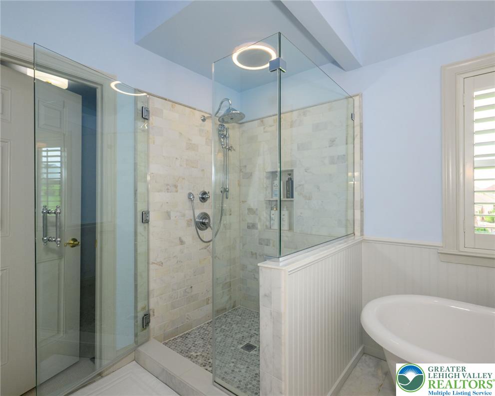 217 Gower Road Nazareth, PA 18064 - Photo 25 of 44 An inviting shower with glass enclosure and mosaic tile flooring awaits in this elegant bathroom.