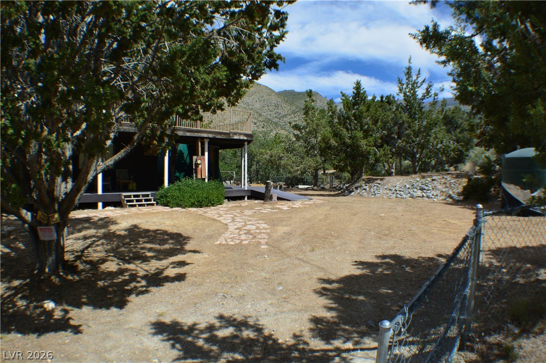 1321 Trout Canyon Road Las Vegas, NV 89124 - Photo 2 of 50 A tranquil mountain-view property with ample yard space and natural landscaping.