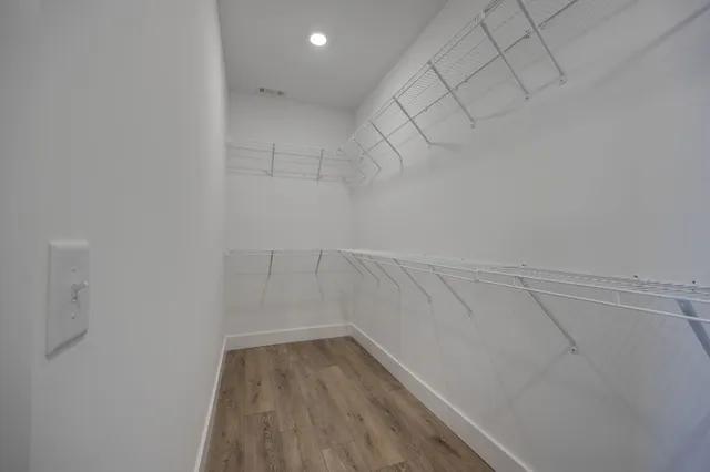 a view of a room with racks on the wall