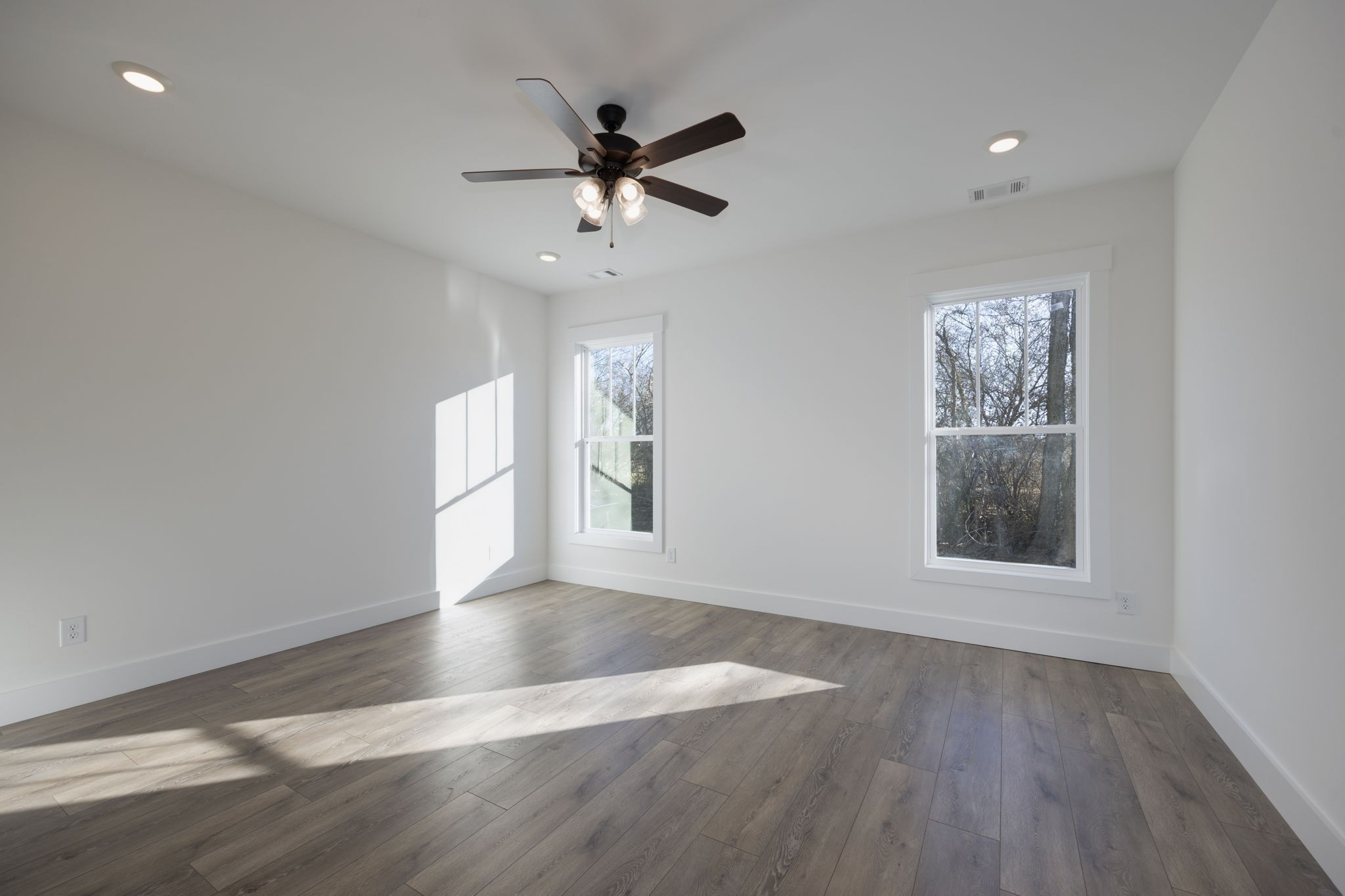 2175 Rylee Way Greenbrier, TN 37073 - Photo 9 of 19 a view of an empty room with wooden floor and a window