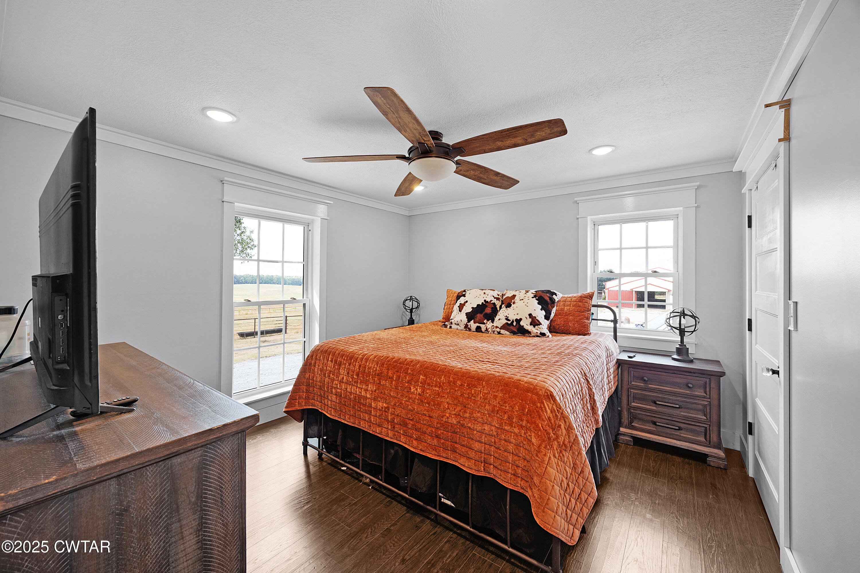 278 Burrow Road Friendship, TN 38034 - Photo 12 of 28 a bedroom with a bed and a flat screen tv
