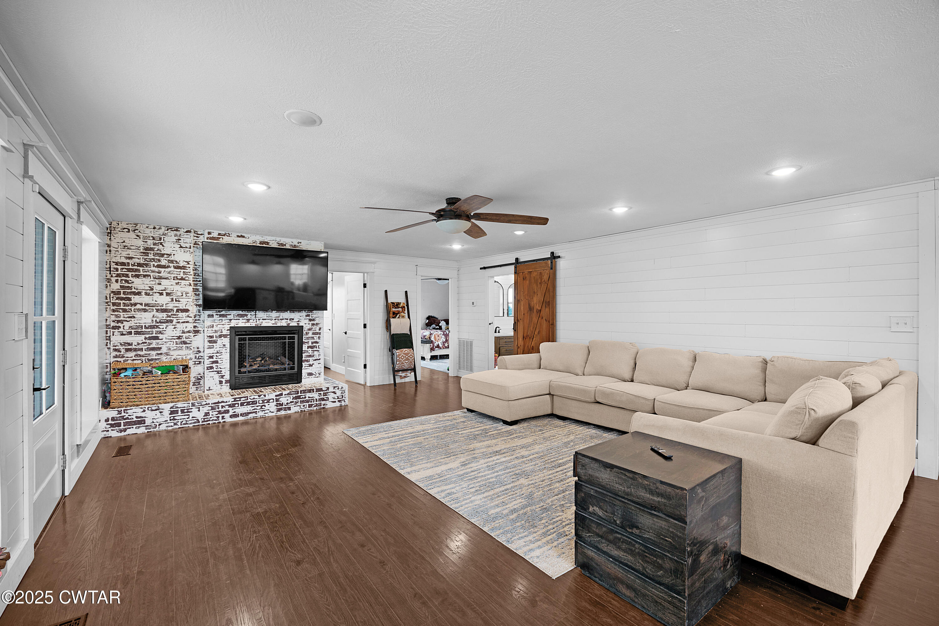 278 Burrow Road Friendship, TN 38034 - Photo 3 of 28 a living room with furniture fireplace and flat screen tv