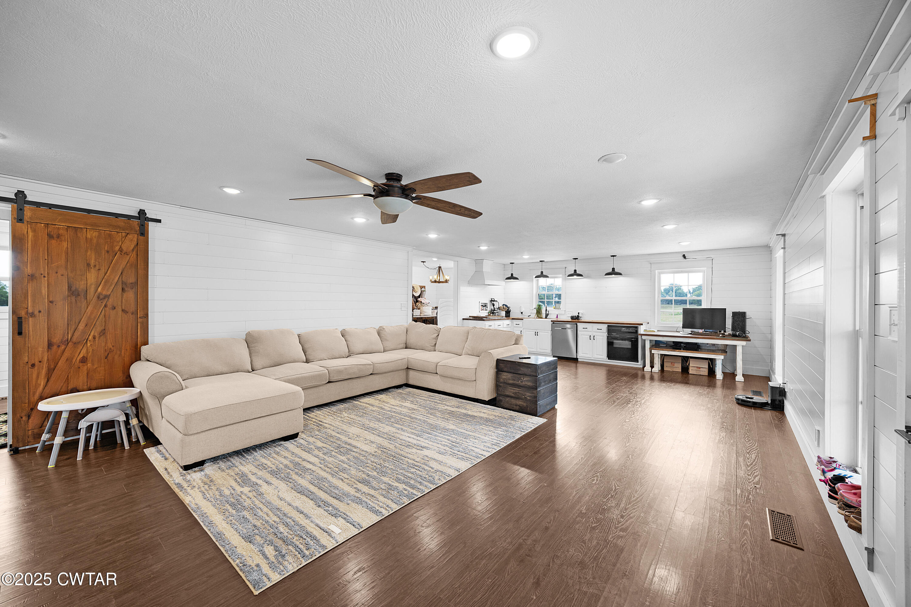278 Burrow Road Friendship, TN 38034 - Photo 6 of 28 a living room with furniture and a wooden floor
