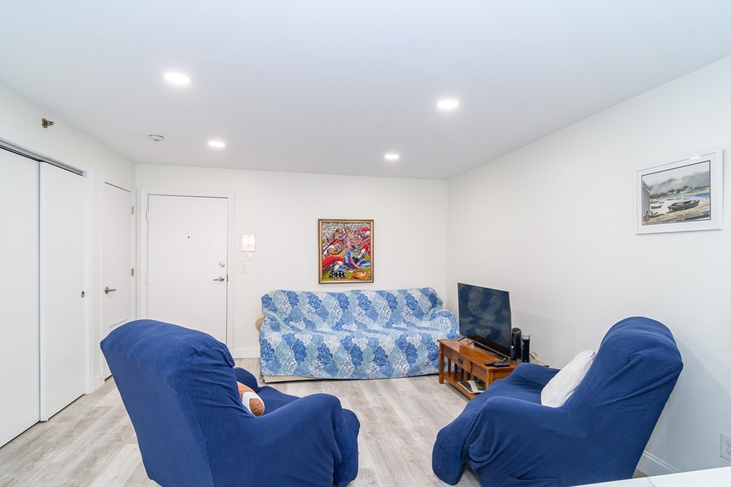 71 Edgeworth Street, Unit 21 Worcester, MA 01605 - Photo 4 of 14 a living room with furniture and a couch