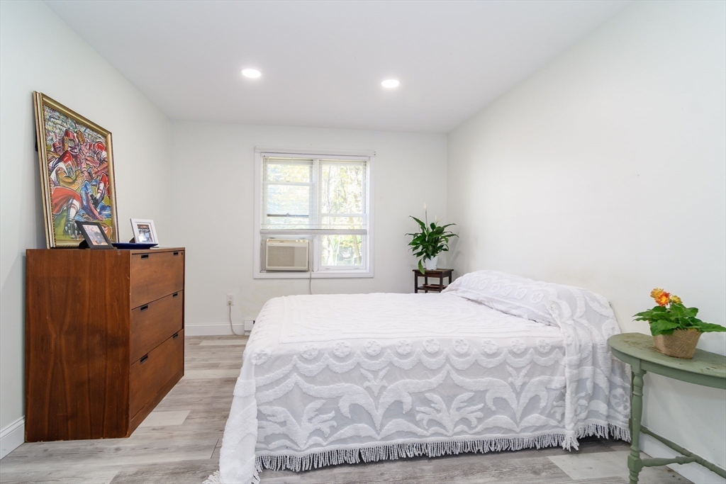 71 Edgeworth Street, Unit 21 Worcester, MA 01605 - Photo 7 of 14 a bedroom with a bed and a window