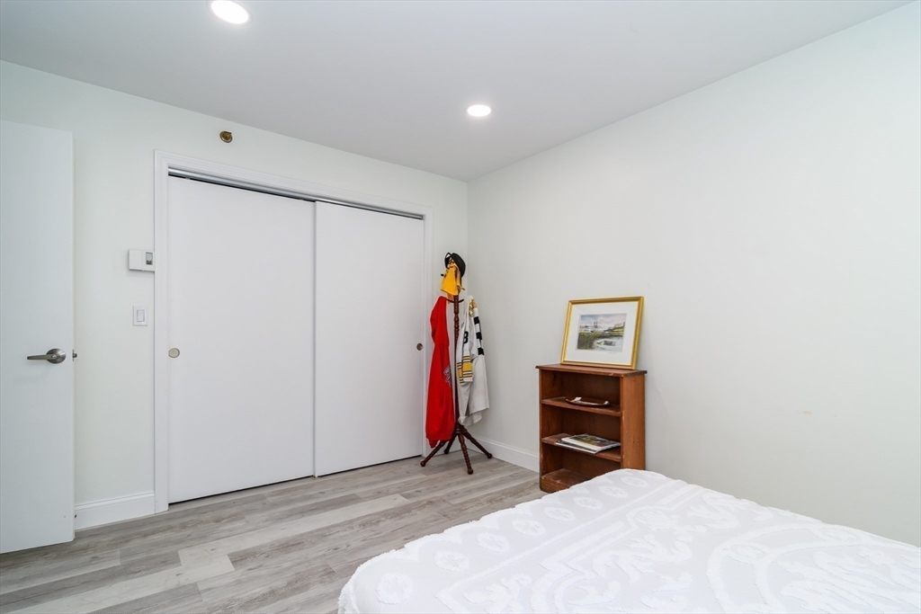 71 Edgeworth Street, Unit 21 Worcester, MA 01605 - Photo 10 of 14 a bedroom with a bed and a closet
