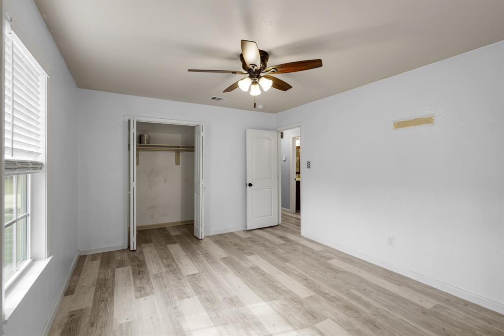 202 Blocker Bridgeport, TX 76426 - Photo 13 of 27 a view of a livingroom with a ceiling fan and window