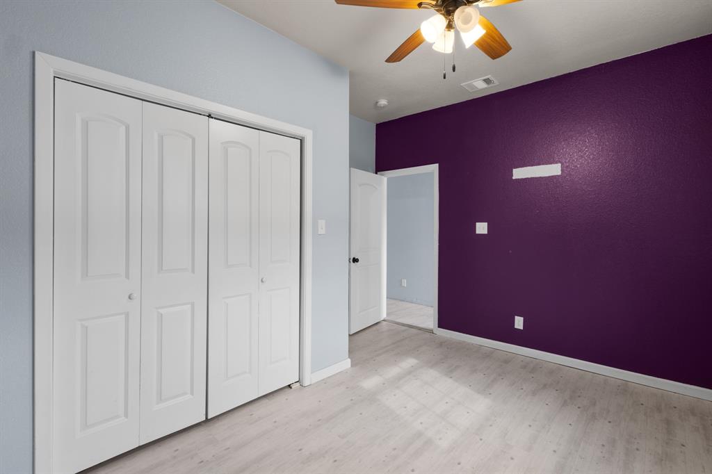 202 Blocker Bridgeport, TX 76426 - Photo 15 of 27 an empty room with a ceiling fan and carpet