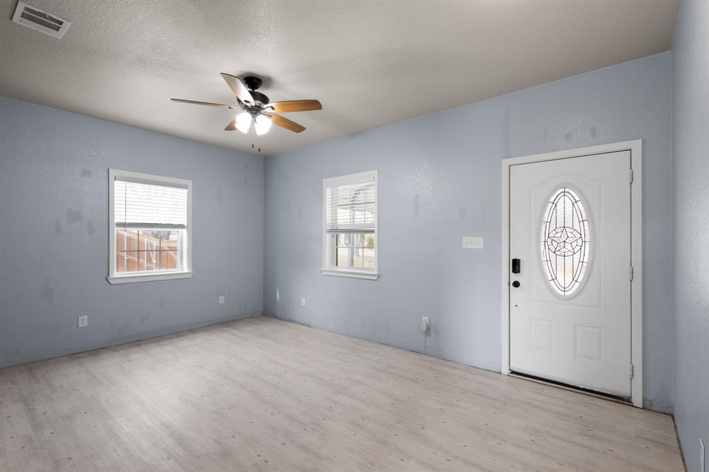 202 Blocker Bridgeport, TX 76426 - Photo 26 of 27 an empty room with windows and fan