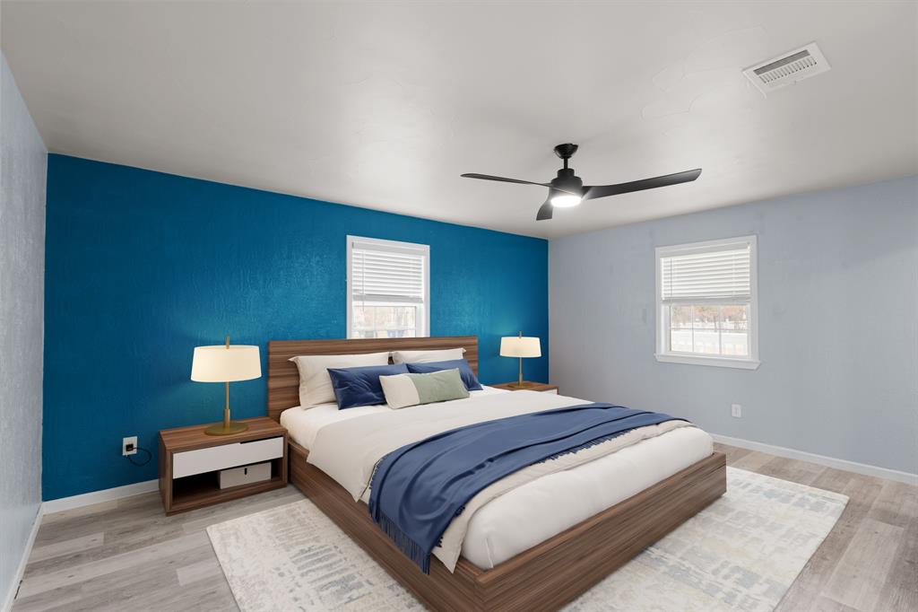 202 Blocker Bridgeport, TX 76426 - Photo 7 of 27 a bedroom with a bed and a ceiling fan