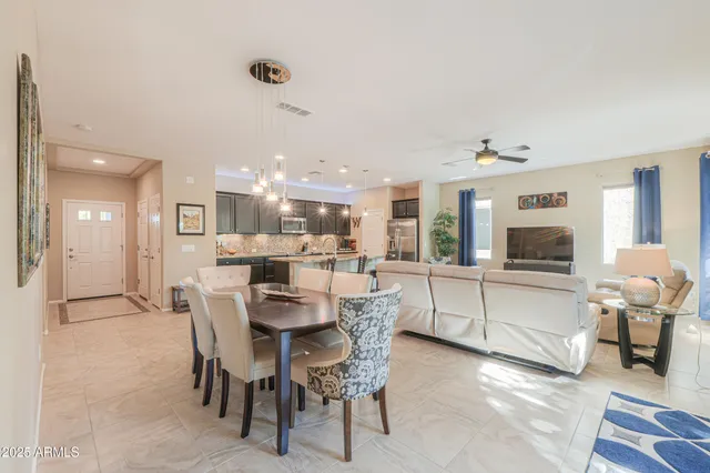 a dining room with furniture and window