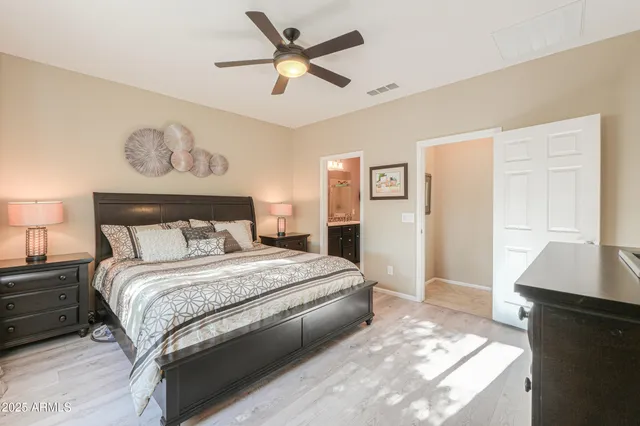 a bedroom with a large bed and a window