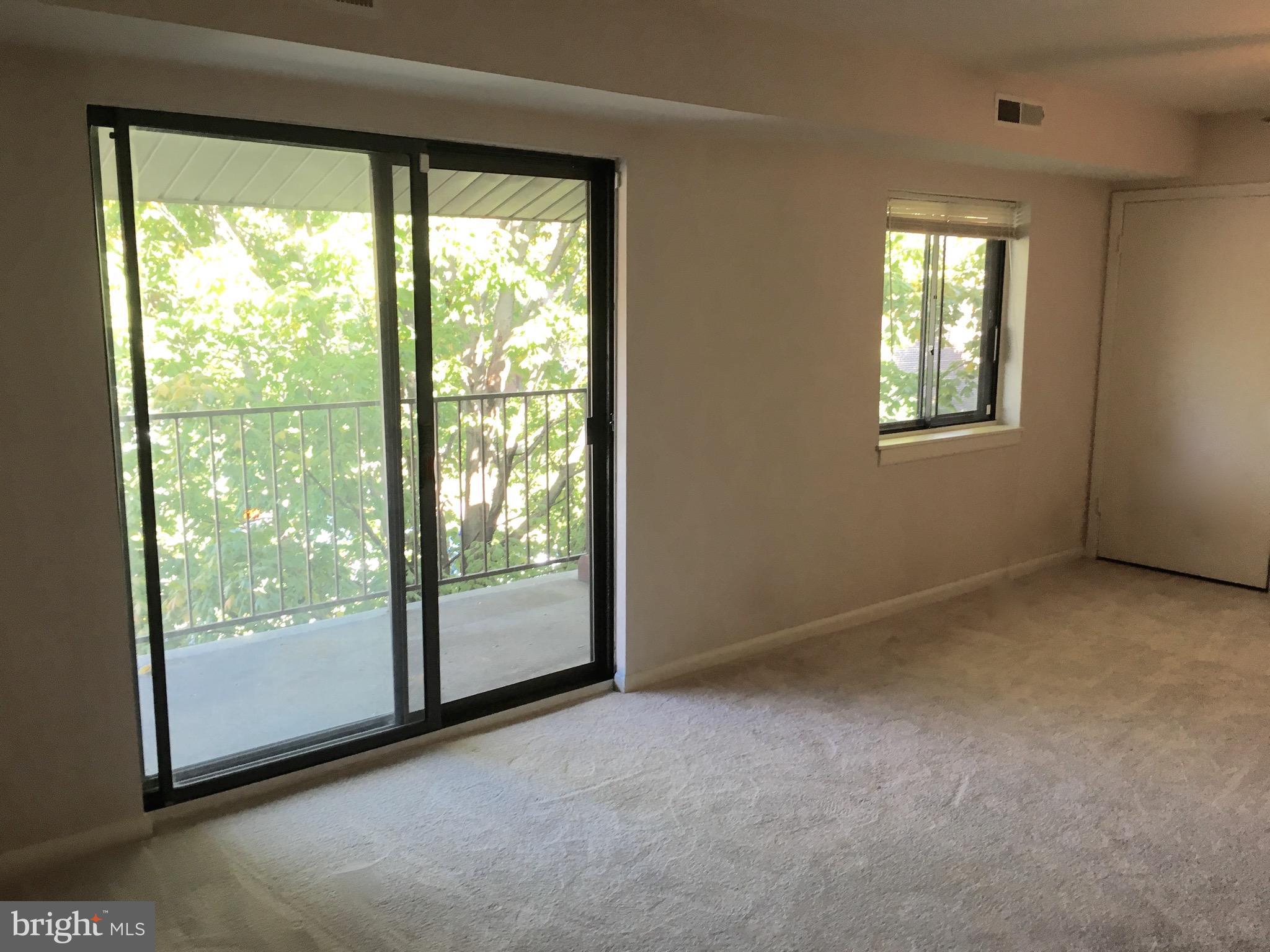 6260 Edsall Road, Unit 401 Alexandria, VA 22312 - Photo 11 of 30 a view of a room with large windows