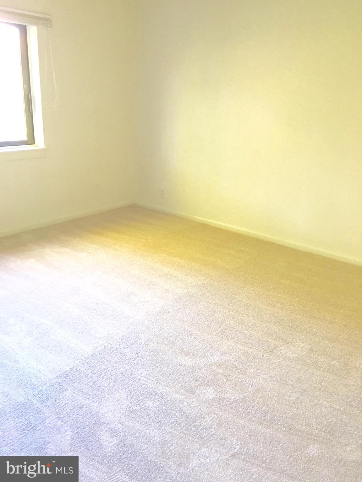 6260 Edsall Road, Unit 401 Alexandria, VA 22312 - Photo 14 of 30 an empty room with a natural light