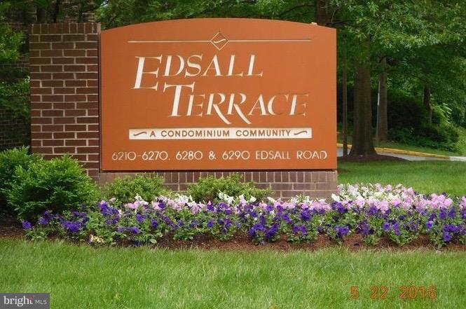 6260 Edsall Road, Unit 401 Alexandria, VA 22312 - Photo 22 of 30 a sign that is sitting in front of flowers