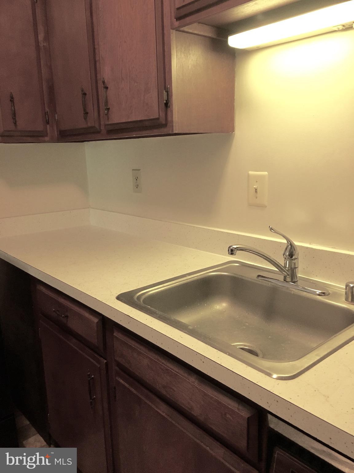 6260 Edsall Road, Unit 401 Alexandria, VA 22312 - Photo 6 of 30 a close view of sink and tap