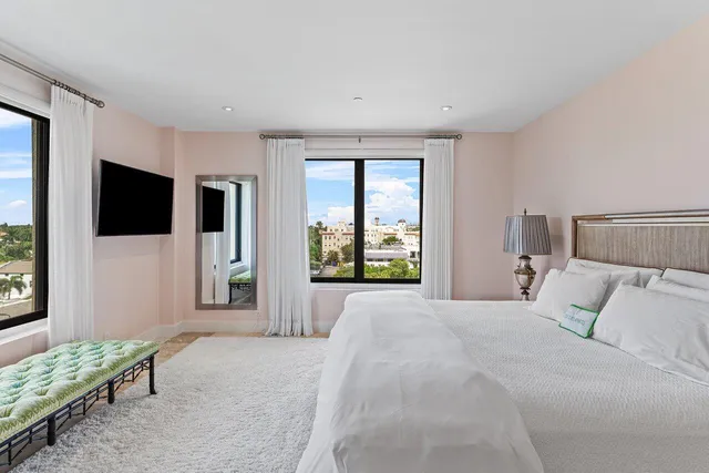 a bedroom with a bed and a couch