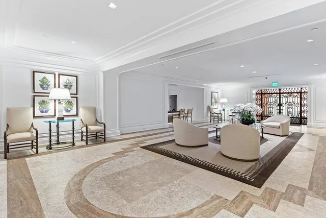 a living room with furniture and a dining table