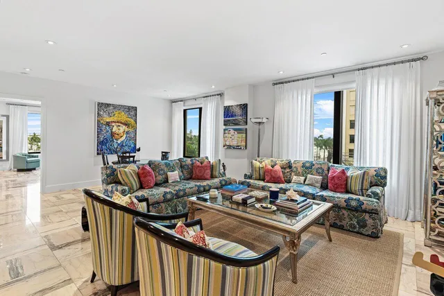 a living room with furniture and breakfast area