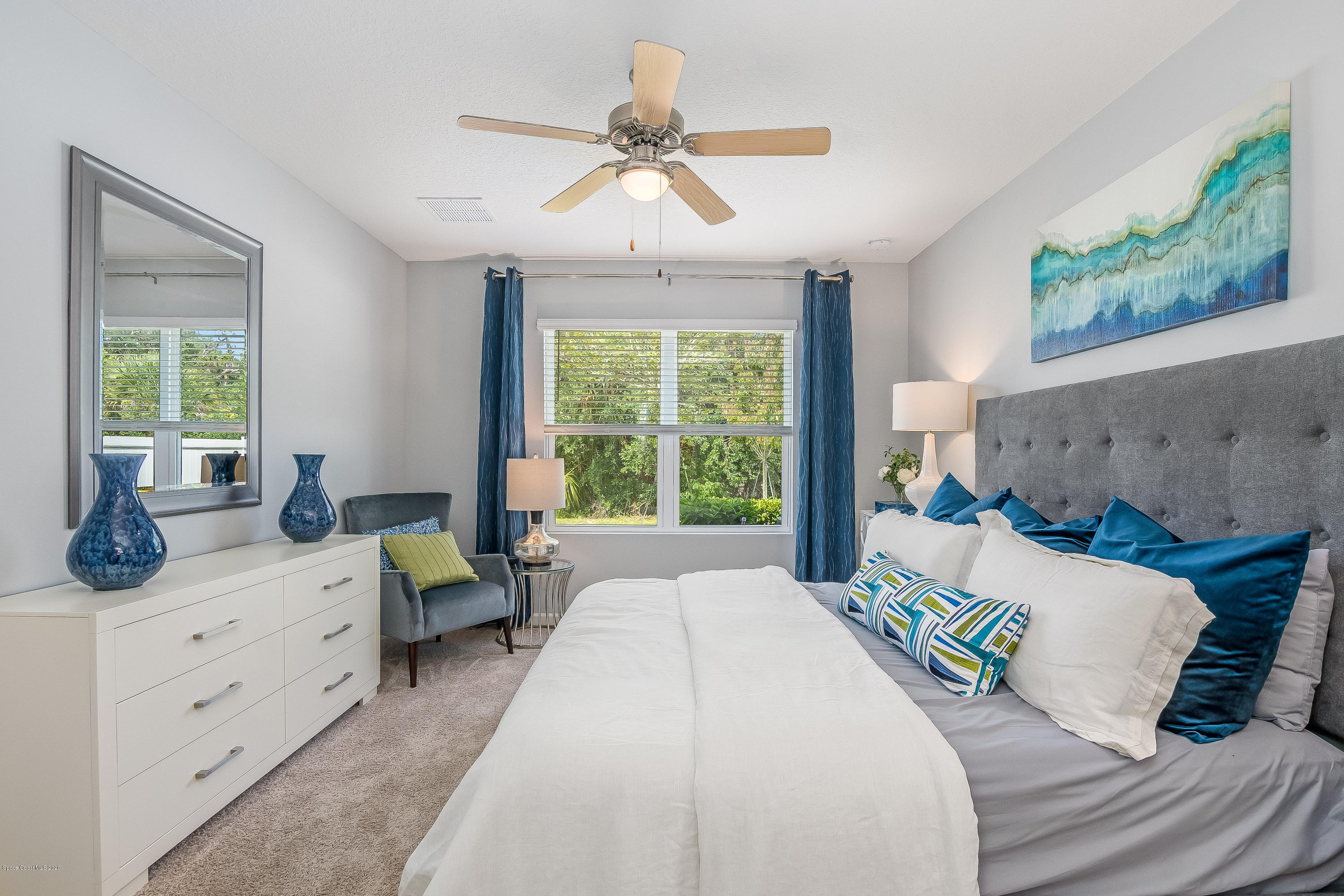 3873 Sandhill Crane Circle Mims, FL 32754 - Photo 12 of 32 a bed room with a bed and a couch