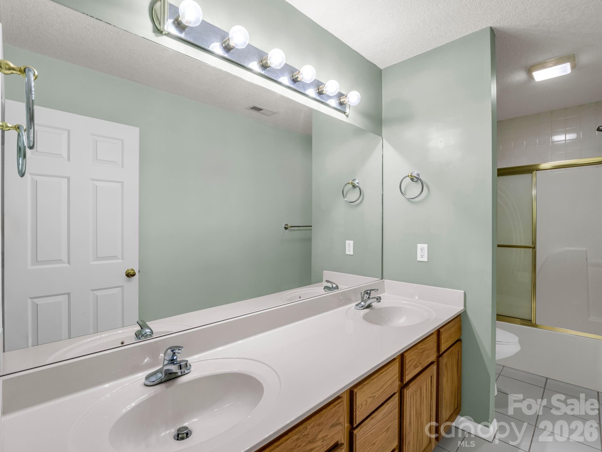4 Rathfarnham Road, Unit 4F Asheville, NC 28803 - Photo 29 of 33 a bathroom with a sink and a mirror