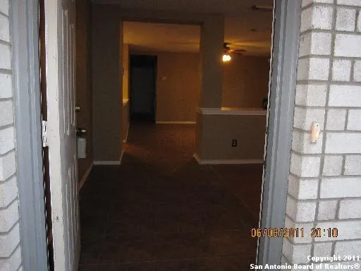 an empty room with wooden floor and small space