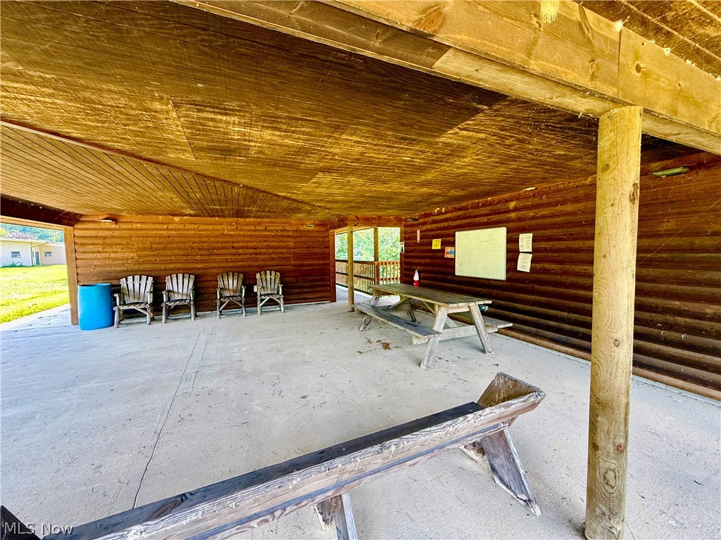 79601 Adams Road Freeport, OH 43973 - Photo 13 of 49 Covered porch of log bathhouse