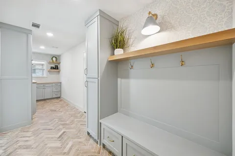 a kitchen with cabinets and window
