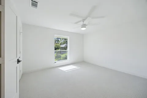 a bathroom with a double vanity sink toilet mirror and shower