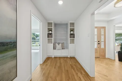a view of a room with wooden floor and windows