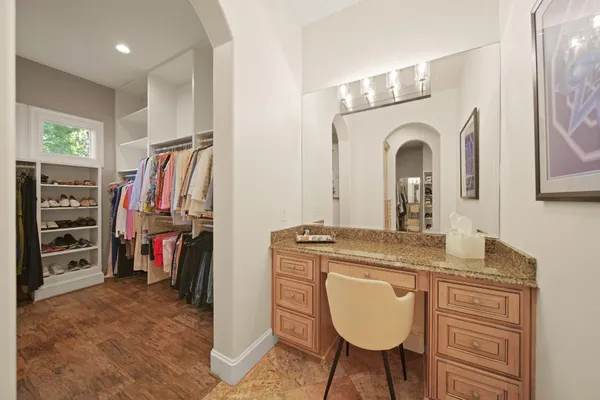 a view of a kitchen with a sink and a refrigerator