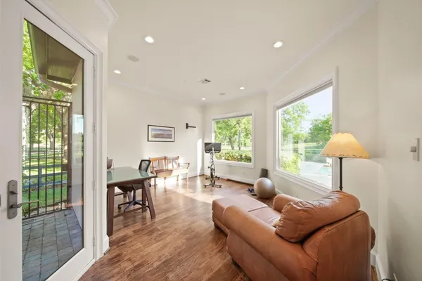 a living room with furniture and a lamp