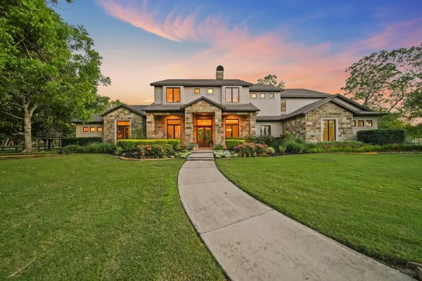 a front view of house with yard and green space