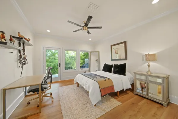 a bed room with a bed and a chair