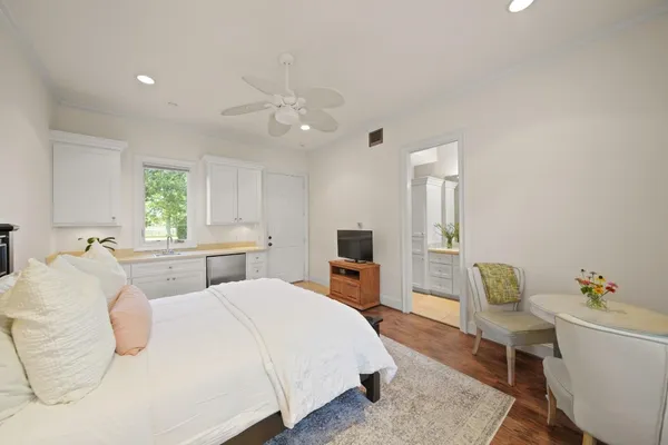 a bedroom with a bed and a chair