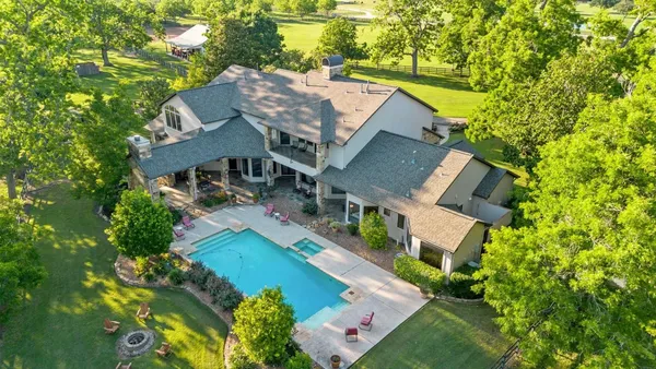 an aerial view of a house with a garden