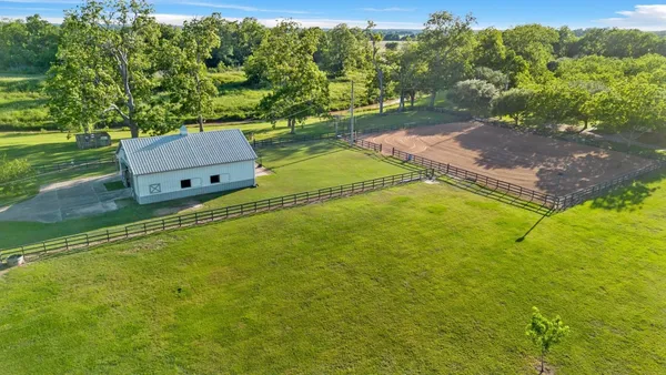a aerial view of a house with a big yard