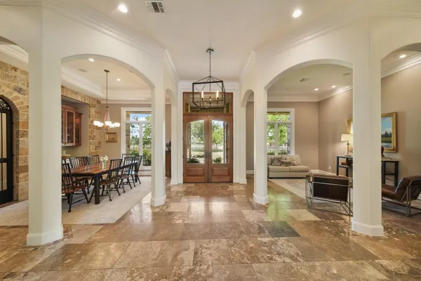 a view of a lobby with furniture and floor to ceiling window