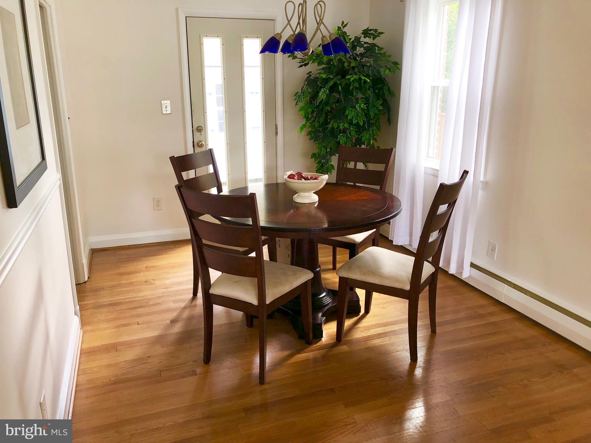 1908 Clifden Road Baltimore, MD 21228 - Photo 14 of 47 Dining room with a door that opens to a huge patio