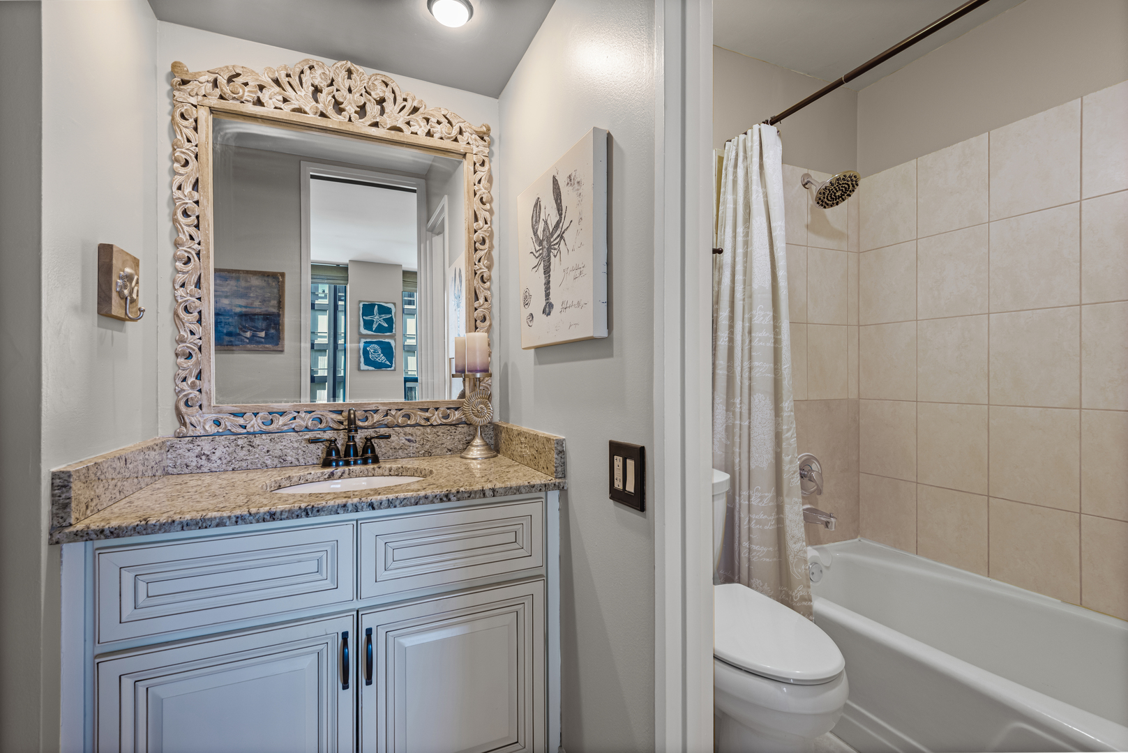 260 East Chestnut Street, Unit 611 Chicago, IL 60611 - Photo 12 of 20 a bathroom with a granite countertop sink toilet and shower